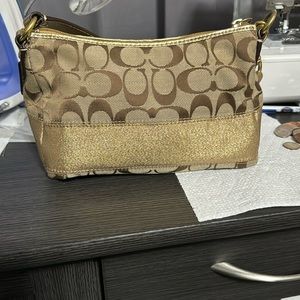 Metallic gold and brown color small purse.